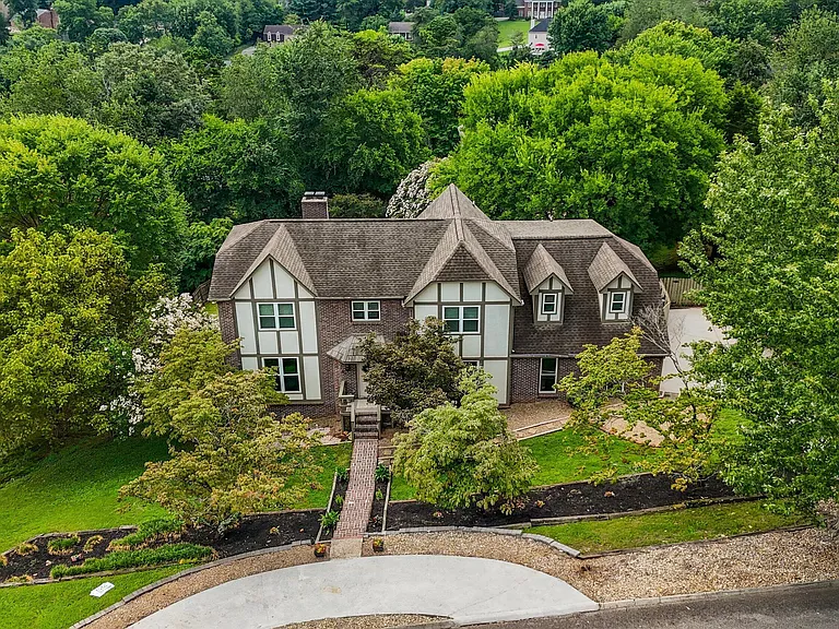 Front aerial view of Tudor home at 11016 Calloway View Dr