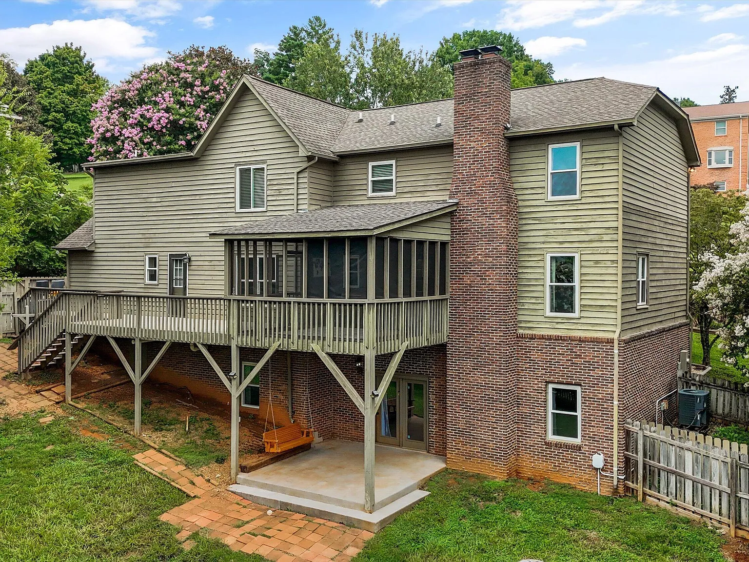 Rear exterior with deck and walkout basement at 11016 Calloway View Dr