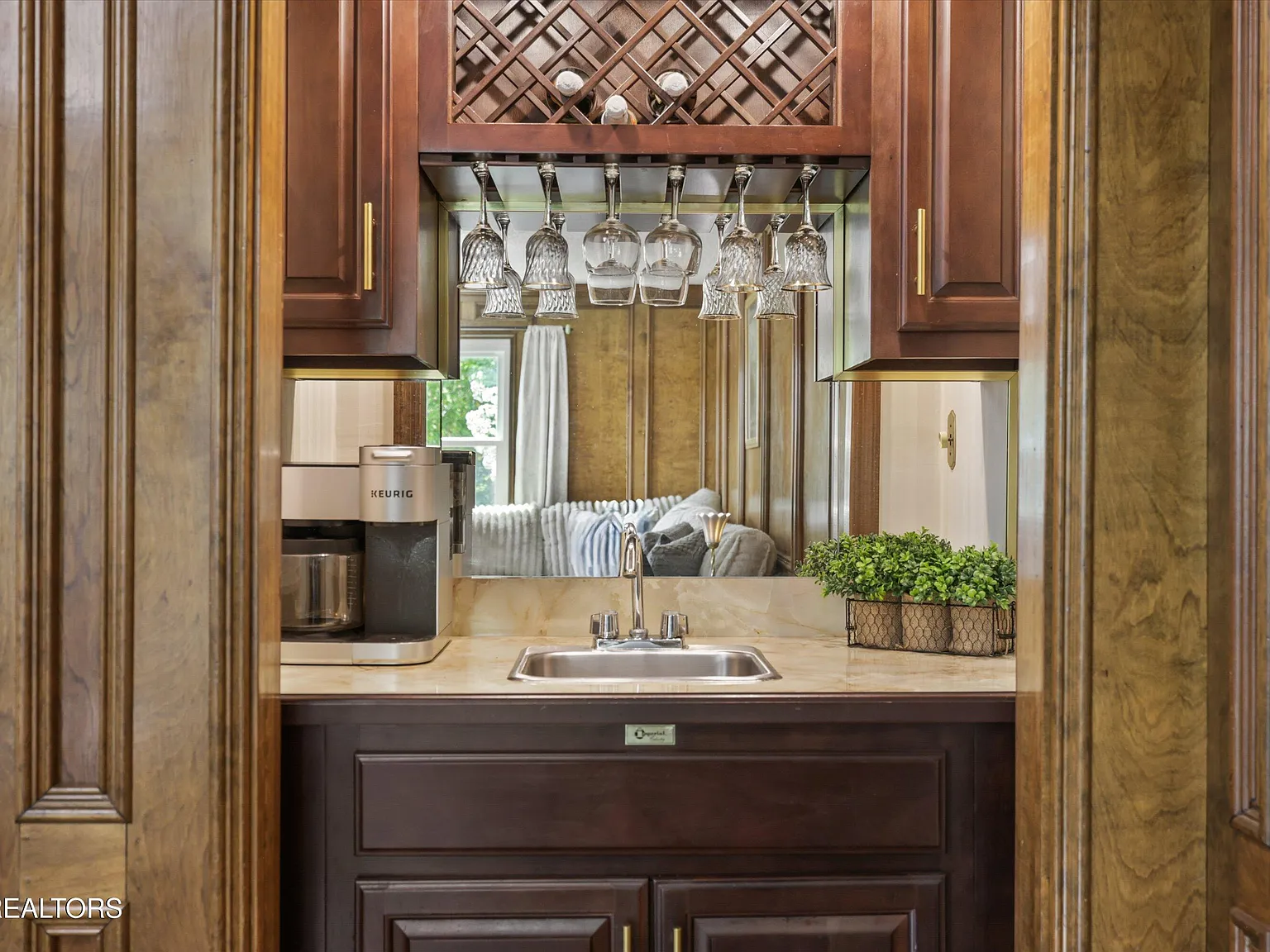 Wet bar with glass storage at 11016 Calloway View Dr